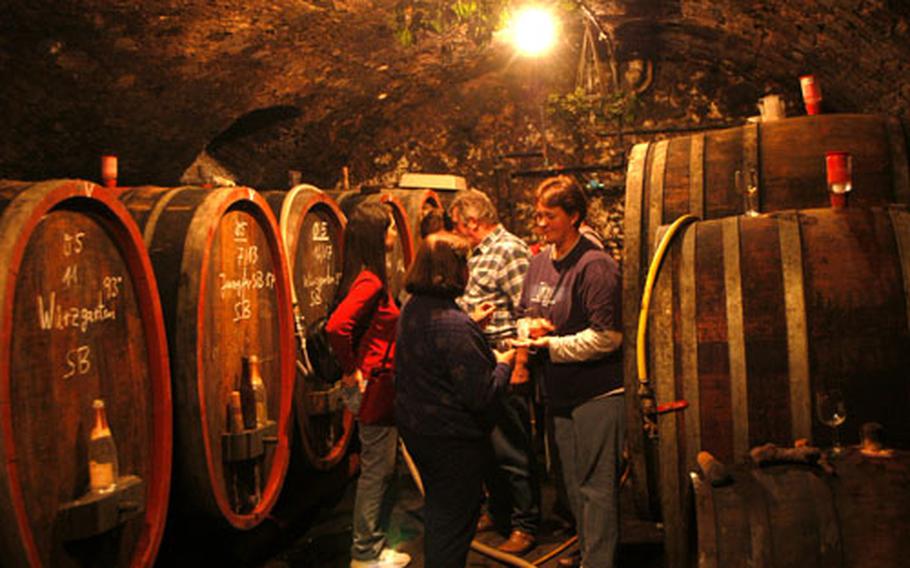 Helmut Rappenecker lets his guests sample a rare Trockenbeerenauslese wine in his wine cellar in the Eberbacher Hof.