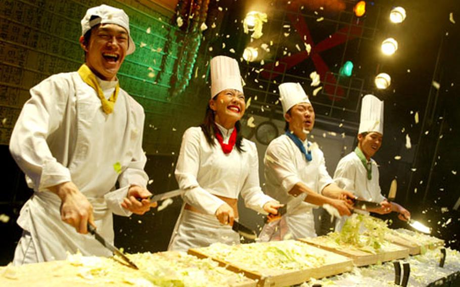 Cabbage flies as Nanta’s drummers use pots, pans, flames, knives and a variety of utensils to bang out a story about a kitchen staff’s follies while preparing a wedding feast.