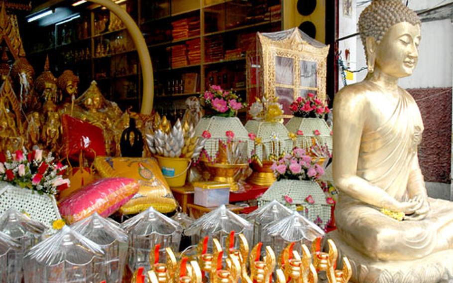 Some shops in Bangkok are dedicated to selling all things Buddha: offerings, decorations and even statues and trimming to set up a shrine at home.