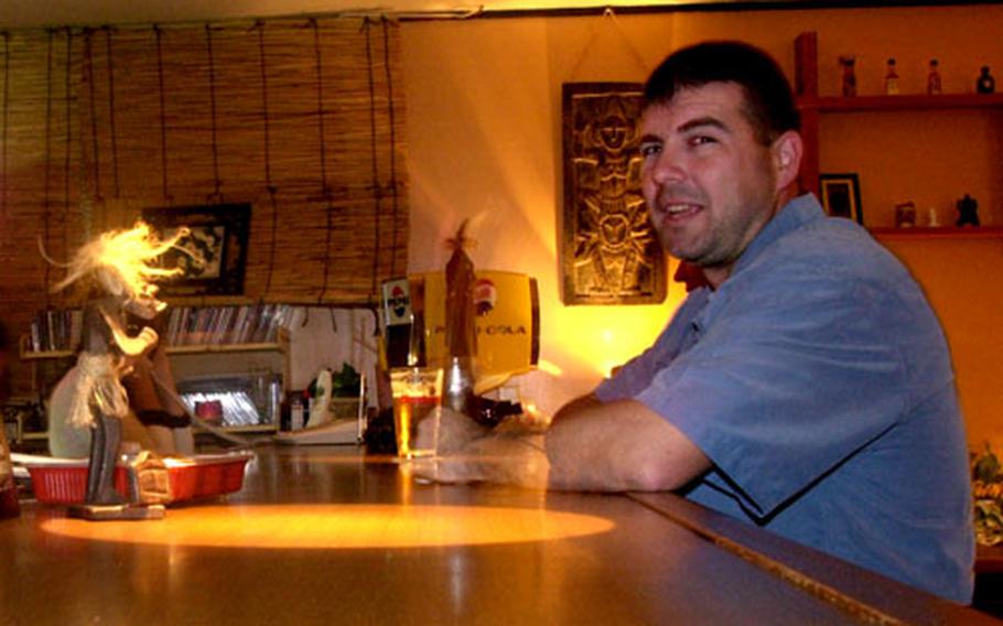 Ron Strickell enjoys a beer at The Peach, a few miles down the road from Awase Meadows Golf Course. The Peach has been serving up food and drinks on Okinawa since 1997.