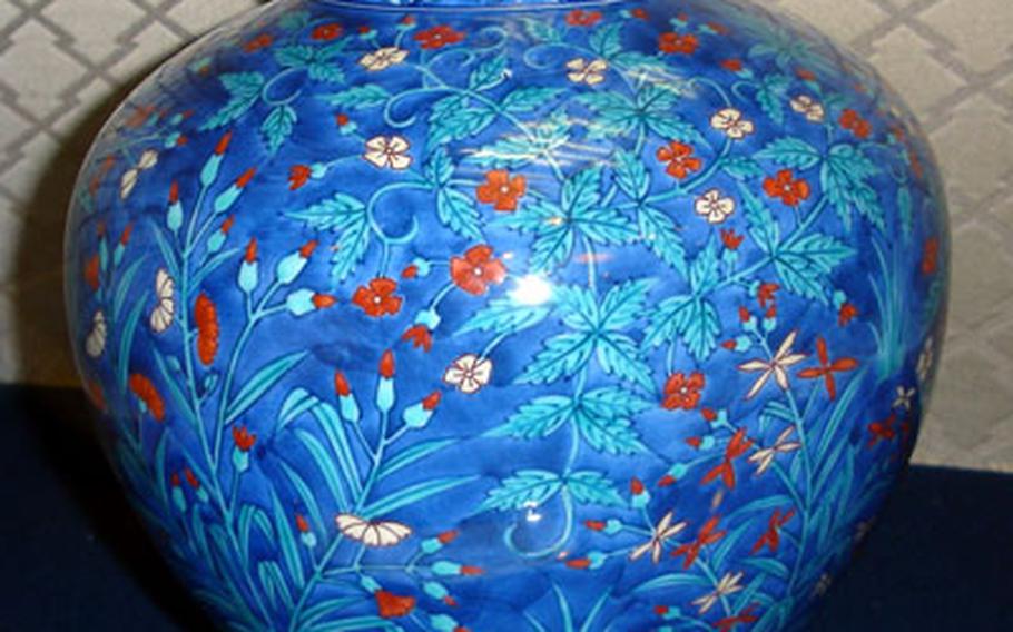 This is the twin of a vase given to President Gerald Ford by Japanese Emperor Hirohito during Ford’s presidency. The artwork on the vase made by Imaemon XIII, Imaemon XIV’s father, was inspired by the red, white and blue of the United States flag.