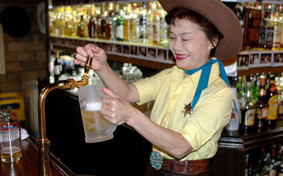 Keiko Tamano has worked at The Westerner for more than 30 years. The Westerner is one of the more popular bars in Sasebo, Japan, among Americans, offering an ample supply of comfort, hospitality and Old West flavor.