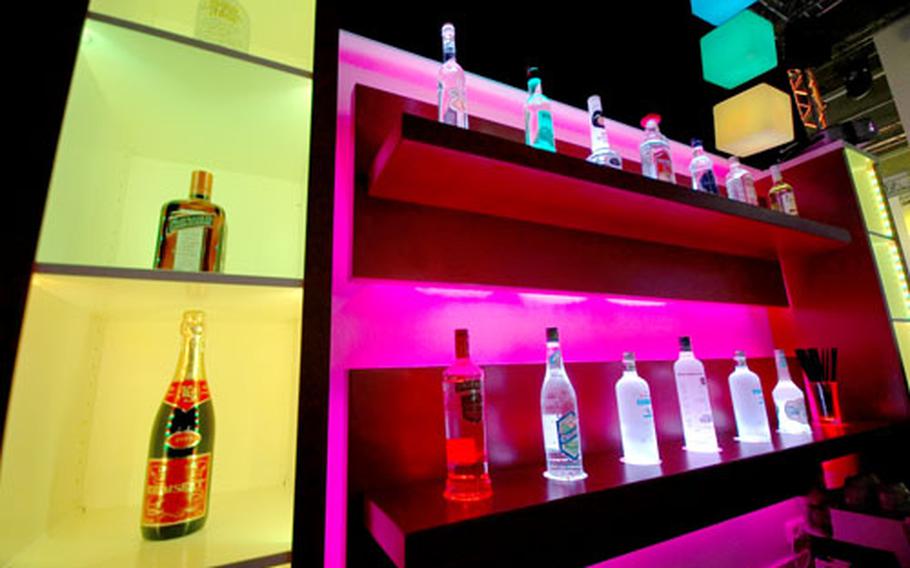A glowing bar display by the German lighting company bocom combines lights, color and music to create an atmosphere for bars, nightclubs and production companies.
