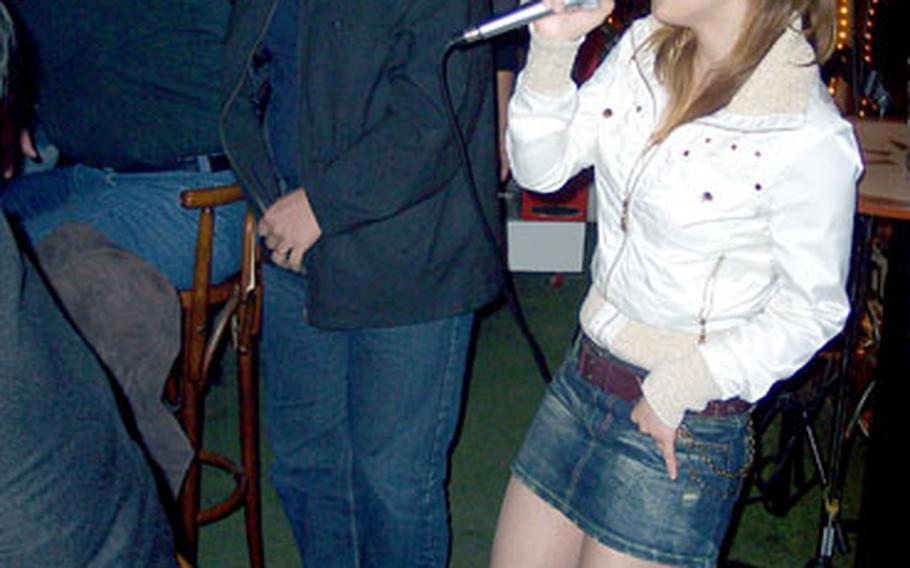 Customers like to get in on the entertainment when the karaoke microphone comes out at the West Rock Bar in Seoul.