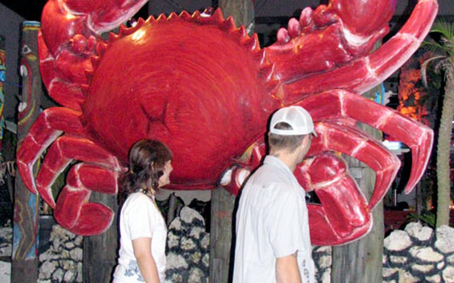 Look for the giant red crab sculpture at the entrance to the Crocodile Seafood & Bar in Chatan, Okinawa.