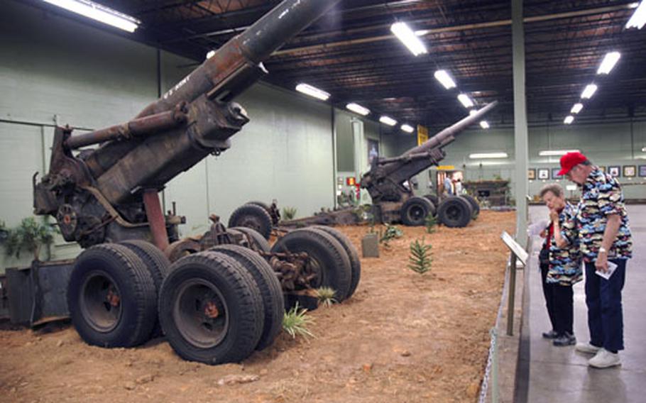 Museum visitors check out the weapons on display. The museum boasts a collection of thousands of items — so many that staff members do not have a full count of what fills the museum’s 333,000-square-foot home.