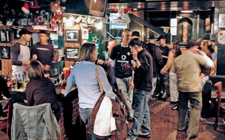Friday-night patrons at the Rocky Mountain Tavern find plenty to eat, drink and talk about. The second-story Canadian bar is about a block and a half west of the Itaewon subway station in South Korea.