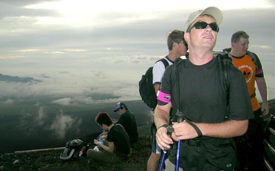 MWR Yokosuka Outdoor Recreation Planner Jude Desnoyer (foreground with sunglasses) led his sixth trip up Mount Fuji on July 22. Each one is different, he said.