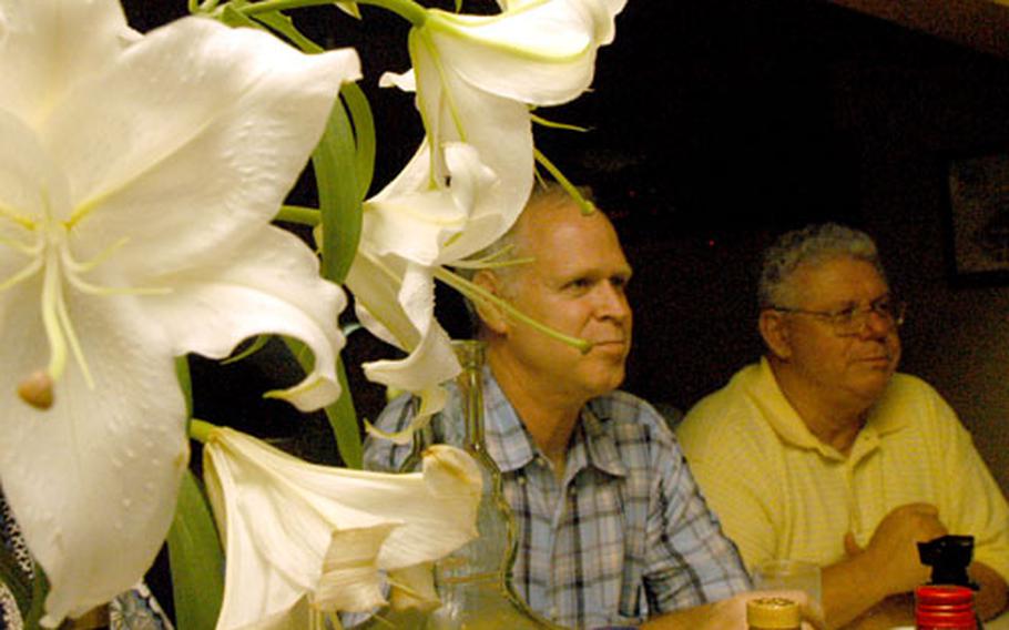 The owner of Casablanca Bar near Yokosuka Naval Base, Japan, gets fresh lilies every week, which gives the karaoke bar a touch of class.