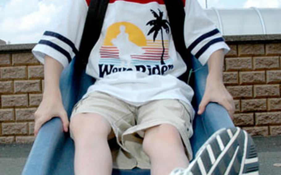 Tyler Ziegler, 7, is ready to slide into the new school year, wearing an Oshkosh T-shirt ($11) and cargo shorts ($18).