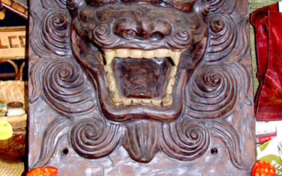 The finished product: this Shisa faceplate will be set into a wall of a home to ward off evil spirits.