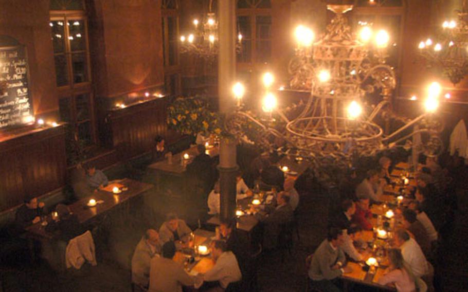 The KulturBrauerei Heidelberg’s main room is a cavernous space lit by broad iron chandeliers by night and gaping windows by day.