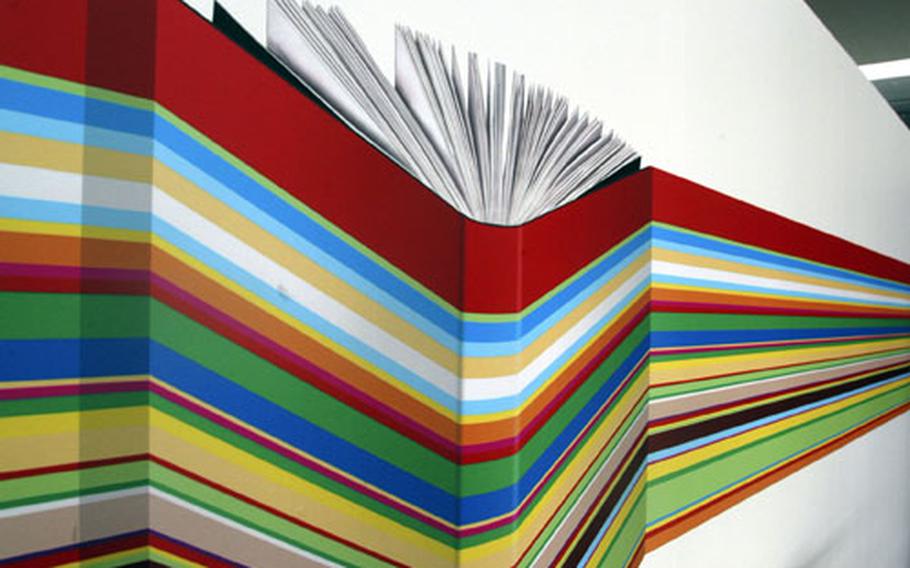 This multicolored design is part of the logo of the Frankfurt Book Fair. It was seen on the fair&#39;s hallways, brochures and display areas.