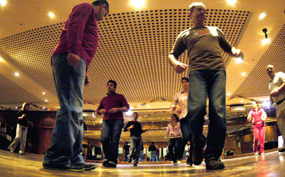 Students practice their salsa moves each Monday and Wednesday at the Salsa Forever classes held at the L’Orizzonte restaurant in Varcaturo, Italy.