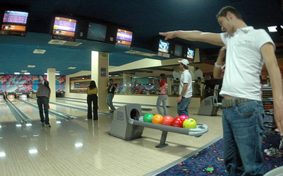 A young Italian bowler encourages his teammate to do her best at the Disco Bowling in Casoria, minutes from the U.S. Navy Capodichino base. The Disco Bowling, located in a sprawling shopping and entertainment complex, is open 10 a.m. to 1 a.m. daily, and features specials such as "surprise Monday" in which prizes are given out, karaoke on Fridays and live bands on the weekends.