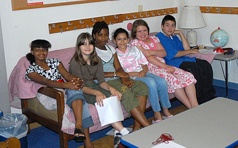 Six members of the Reading 180 class at Würzburg Elementary School in Germany gather to discuss letters to the editor of the Stars and Stripes that they had written as a school assignment. The students are, from left: Alexis Colbert, 11; Kelli O'berry, 11; Nylah Stroud, 11; Juliet Trevino, 10; Hanna Teldenhof, 10; and Chris Bailey, 11.