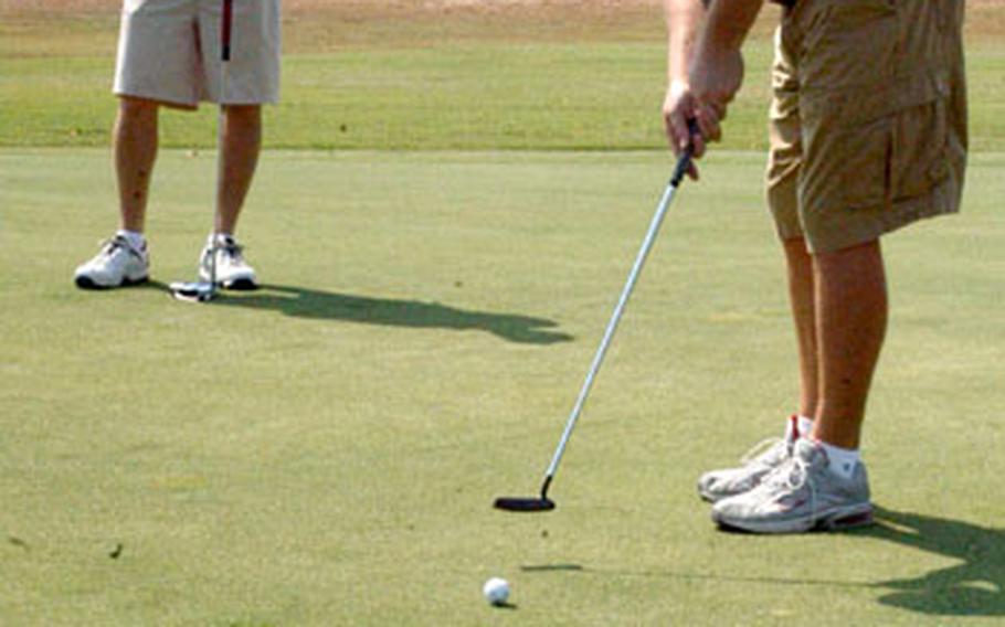 Tech. Sgt. Howard Hall, the reigning Air Force golf champion, sends a putt toward the cup on the ninth green of the golf course at Incirlik Air Base in Turkey. Club manager Bill Anderson said tee time reservations aren’t needed.