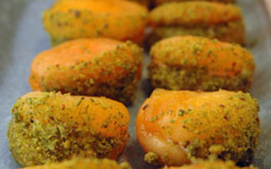 Apricots stuffed with mascopone cheese and dipped in ground pistachios.