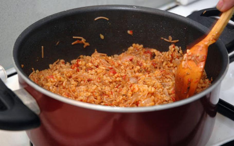 Here is pub style bulgur pilar, a mixture of bulgur, onion, tomato, garlic, red pepper, parsley and dill that is steamed in water.