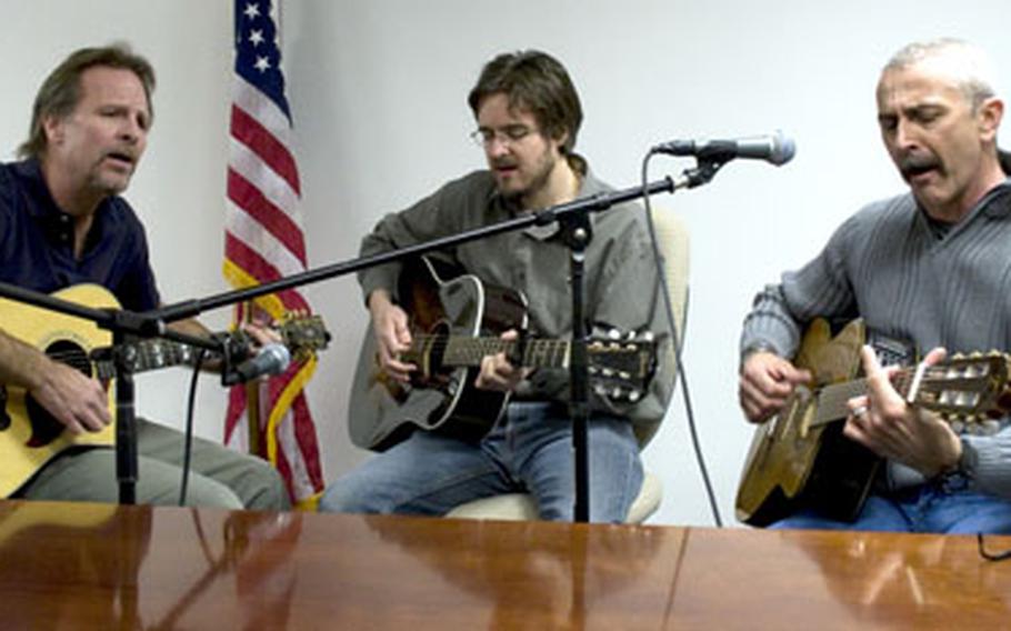 Aaron Tippin performs "Where the Stars and Stripes and the Eagle Fly" at the Stars and Stripes office in Washington, D.C., in January.