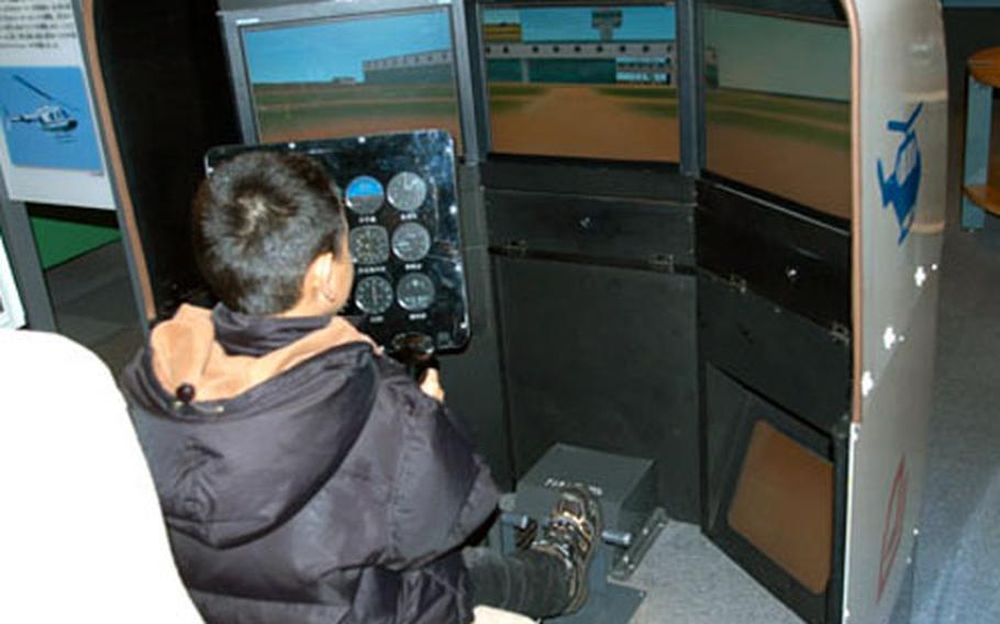 Visitors to the Misawa Aviation and Science Museum near Misawa Air Base, Japan, can take the controls of a simulated HS21 helicopter. The museum is open 9 a.m. to 5 p.m., Tuesday through Sunday.