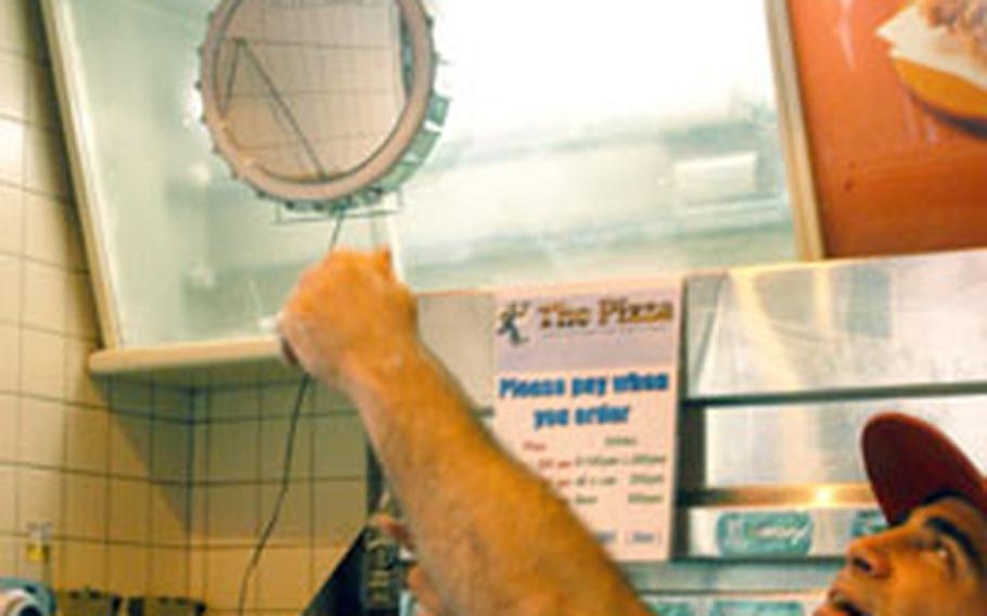 Hand-tossed, homemade pizza is the only thing on the menu at Alex Knight&#39;s I Love NY Pizza parlor in Yokosuka&#39;s Honch.