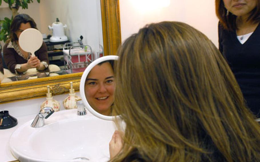 TeriWeaver gets her first peek at her fuller lashes.
