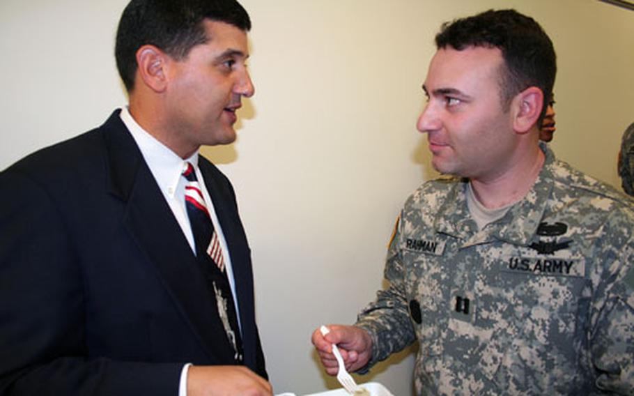 Cousins Butch, left, and Eric Rahman sample the newest MRE menus foods at the Pentagon. The pair, who grew up together in Natick, Mass., were informal taste testers for MRE prototypes developed by Butch’s father, Abdul Rahman.