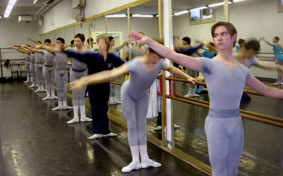 Trevor Martin warms up with his classmates at the start of one of his dance class in the School of Ballet at Teatro San Carlo in downtown Naples, Italy.