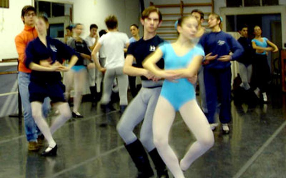 Trevor works with his Italian classmates during a partnering class.