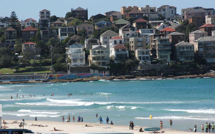 World-famous Bondi Beach is a major attraction in Sydney, Australia. The magnificent setting features white sand, clear surf and abundant sunshine. Shaped like a horseshoe, it’s surrounded on both sides by large rocks and Mediterranean-style houses.