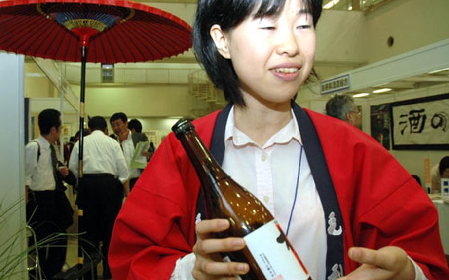 Part of the tasting fair included a room full of the sake makers and distributors. This woman sold sparkling sake, akin to champagne, and cheese-filled mochi, a savory snack made of a rice dough.