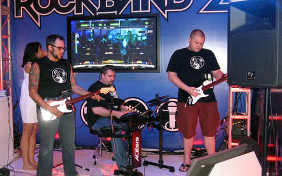 “Rock Band 2” — seen with the special Ion drum kit — gets a workout at the E3 Media & Business Summit.