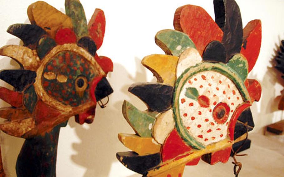 Brightly-painted chicken and rooster figures once decorated traditional Korean funeral biers.