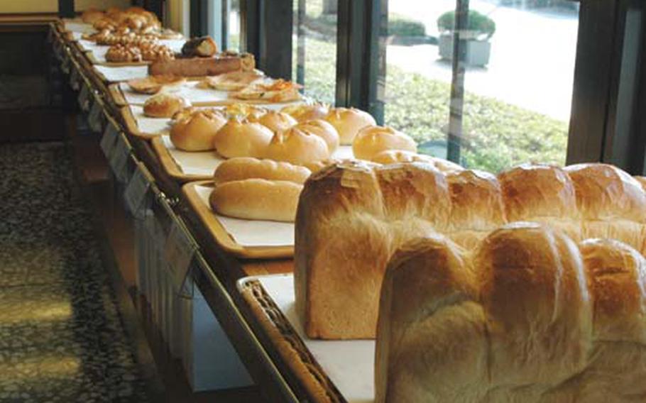 Loaves of fresh-baked bread and other baked goods line the shelves of Saint Marc, a bakery and restaurant located in Fussa, Japan.