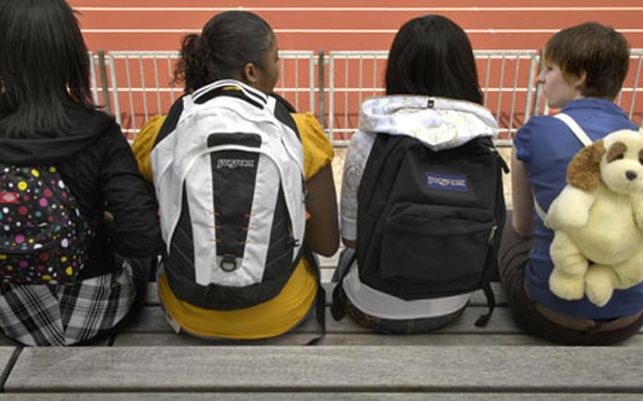 Ben Bloker/Stars and Stripes Always an important item for those heading back to school is the backpack. Ashley Fagan, Destiney Lynch, Malaysia Mondek and Ashley Cremeons show off the latest backpacks, including those made by Dickies and Jan Sport and one featuring a stuffed animal.