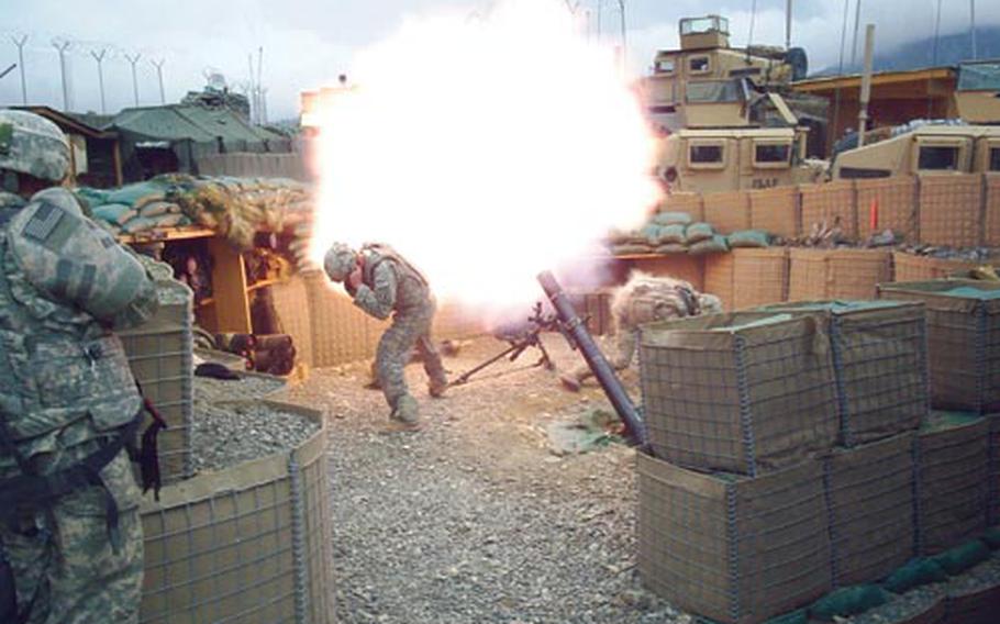 Mortarmen fire off a round at Malekshay Combat Outpost in Bermel District. Soldiers manning the mortars were kept busy during the deployment, firing off thousands of rounds.