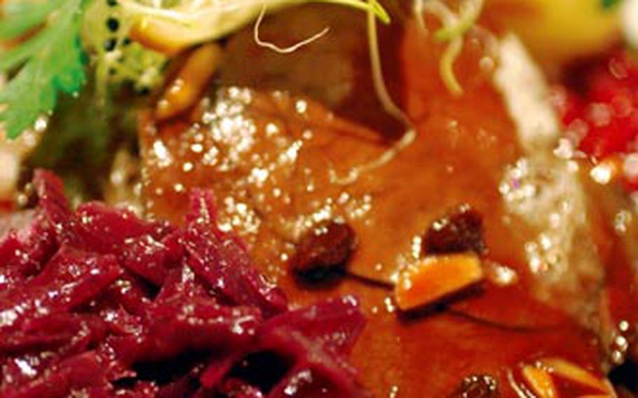 A plate of venison sauerbraten, red cabbage and dumplings tastes as good as it looks – if not better.