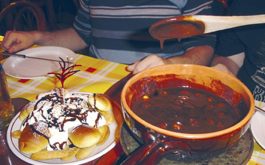 What fondue experience would be complete without melted chocolate? Happy Rock serves chocolate fondue with hazelnuts and a plate of Italian cookies.