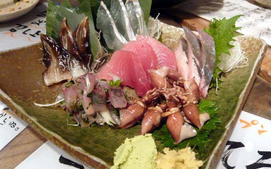 Assorted fresh slices of raw fish, called sashimi, is fresh and in season at Uoshin. The types of fish vary depending on what that day&#39;s catch is.