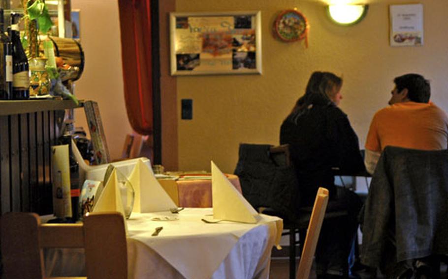 A couple enjoys a quiet dinner at Trattoria da Salvatore Italian restaurant.