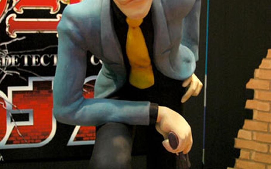 A statue of famed anime character Lupin III winks at passers by in a booth advertising his upcoming television special "Lupin III vs. Detective Conan" at the 2009 Tokyo International Anime Fair.