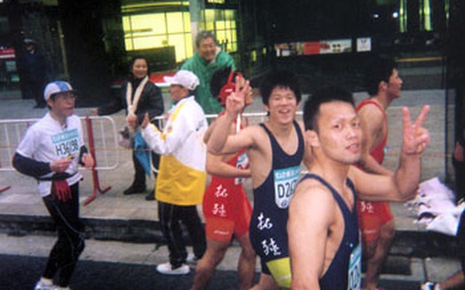 This group of wrestlers ran together throughout the entire marathon, even carrying one of their mates to the finish line after he suffered an injury.