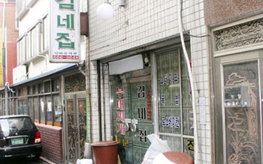 In the Shinjang Shopping Mall area near Osan Air Base, the Kim Neh Jeep restaurant is popular among locals for its house specialty, "bu-teh chi-geh," a spicy stew that came about during the hard days of the Korean War.