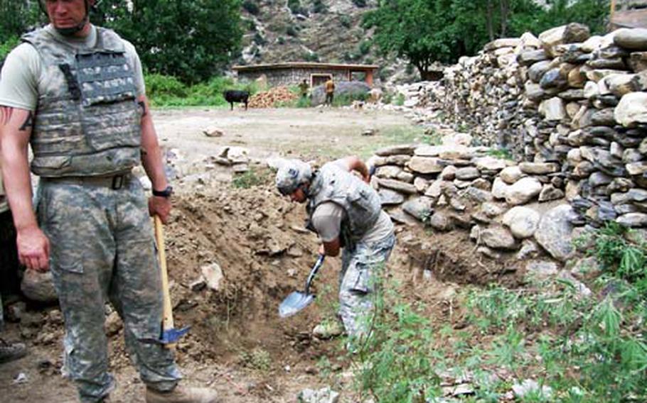 Members of the 2nd Battalion, 503rd Infantry Regiment dig a fighting position in Wanat, Afghanistan. In July 2008, nine members of the unit were killed in an intense firefight when some 200 insurgents attacked their vehicle patrol base.