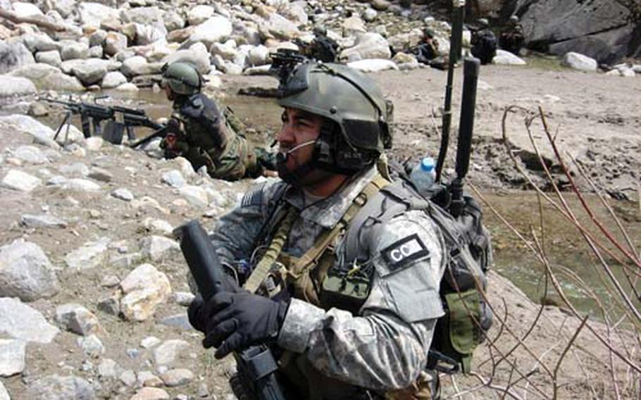 Staff Sgt. Robert Gutierrez Jr. keeps an eye out for insurgents on patrol in Afghanistan.