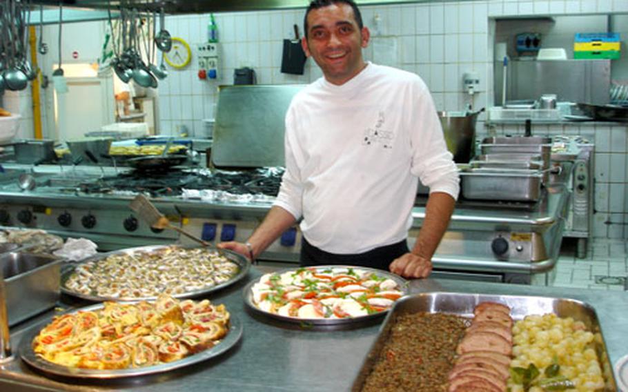 Massimo Esposito prepares some of the appetizers for the massive — and excellent — Ristorante del Pino buffet.