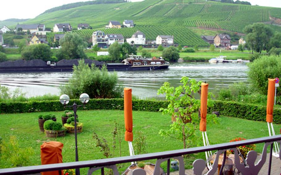 Even an industrial barge, heaped with stacks of coal, floating down the Moselle River could not break the serenity of the scene viewed from the restaurant&#39;s terrace.