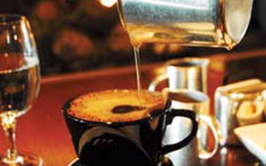 A server at The Library, a lounge at the Shilla Hotel in Seoul, pours water into a strainer of ground Kopi Luwak beans. The coffee, which costs 35,000 won ($28) a cup, is made from beans harvested from the feces of civet cats and is considered a delicacy among coffee lovers.