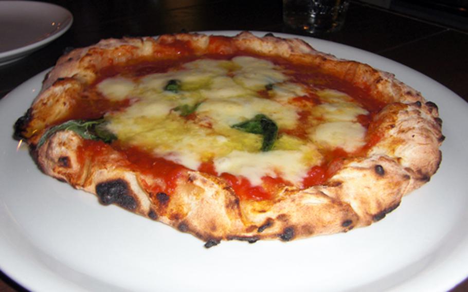 Margherita is one of the two pizzas offered at Bacars. Daisuke Nakamura, chef and owner, takes pride in his meticulous work and he firmly believes that only with a wood-fired oven is it possible to bake a perfect pizza.